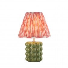 olive green ceramic table lamp with pink ikat pattern shade