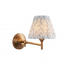 brass wall light with leaf pattern shade in blue