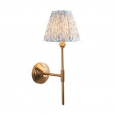 brass t bar wall light with leaf pattern shade in blue