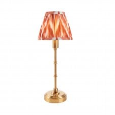 brass rechargeable table lamp with orange zigzag pattern shade