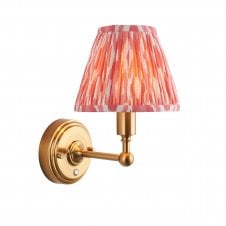 brass rechargeable wall light with pink ikat pattern shade