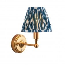 brass rechargeable wall light with blue ikat pattern shade
