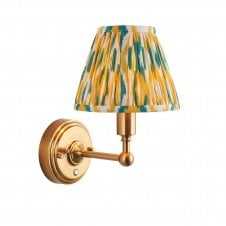 brass rechargeable wall light with yellow & jade ikat pattern shade