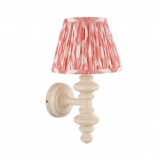 white wall light with pink ikat pattern shade