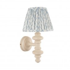 white wall light with blue leaf pattern shade