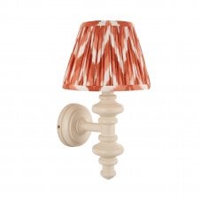 white wall light with orange zigzag pattern shade