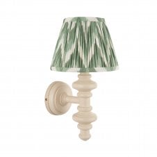 white wall light with green zigzag pattern shade