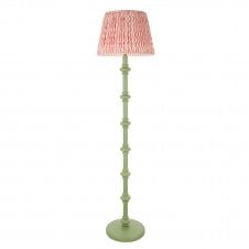 green floor lamp with pink ripple pattern shade