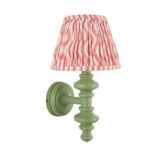 green wall light with pink ripple pattern shade