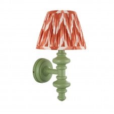 green wall light with orange zigzag pattern shade