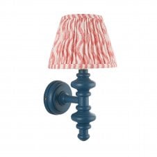 blue wall light with pink ripple pattern shade