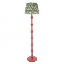 pink floor lamp with green zigzag pattern shade