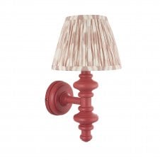 pink wall light with neutral ikat pattern shade