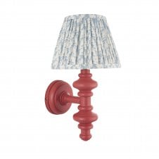 pink wall light with blue leaf pattern shade