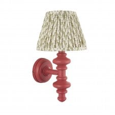 pink wall light with green leaf pattern shade