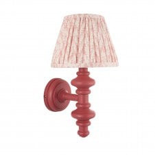 pink wall light with peach leaf pattern shade