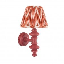 pink wall light with orange zigzag pattern shade