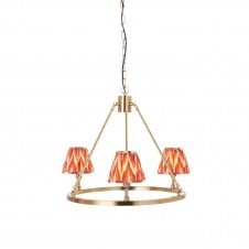 brass circular ceiling light with orange zigzag shades