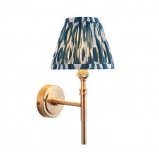 brass wall light with blue ikat pattern shade