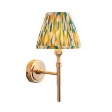 brass wall light with yellow green ikat pattern shade
