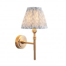 brass wall light with blue leaf pattern shade