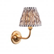 brass wall light with grey ripple pattern shade