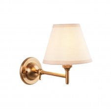 brass wall light with white tapered shade