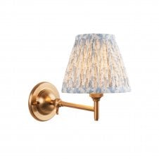 brass wall light with bleu leaf pattern shade