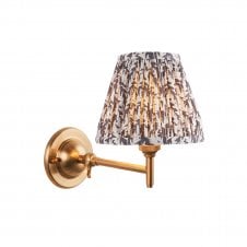brass wall light with grey leaf pattern shade