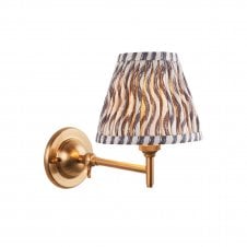 brass wall light with grey ripple pattern shade