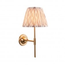 brass wall light with neutral ikat pattern shade