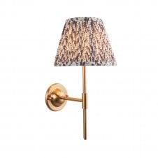 brass wall light with grey leaf pattern shade