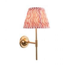brass wall light with pink ripple pattern shade