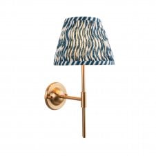 brass wall light with blue ripple pattern shade