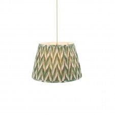 brass and green pendant with green zigzag pattern shade
