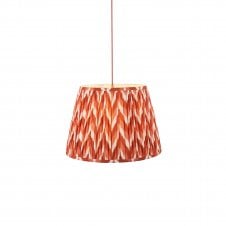 brass and red pendant with orange zigzag pattern shade