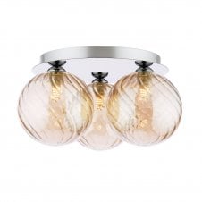 modern flush ceiling light fitting in a polished chrome finish with twisted amber glass shades