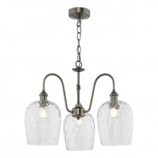a traditional three arm pendant ceiling light with three dimpled clear glass shades