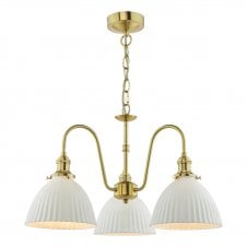 a traditional, vintage-inspired three arm pendant ceiling light with white ceramic dome shades