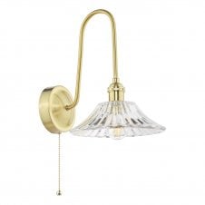 traditional wall light in a brass finish with flared glass shade
