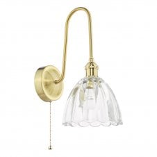 a vintage inspired natural brass wall light with scallop edged bell shape glass shade 