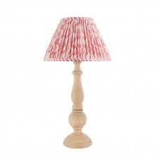 wooden table lamp with pink ripple pattern shade
