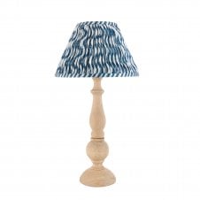 wooden table lamp with blue ripple pattern shade