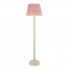 white floor lamp with pink ripple pattern shade