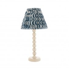 white table lamp with blue ripple pattern tapered shade