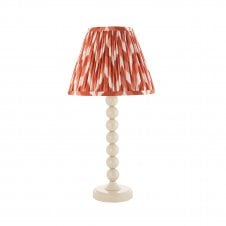 white table lamp with orange zigzag pattern tapered shade