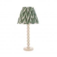 white table lamp with green zigzag tapered shade
