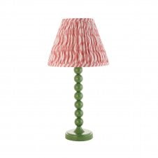 green table lamp with pink zigzag pattern tapered shade