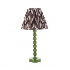 green table lamp with grey zigzag pattern tapered shade