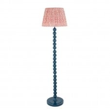 blue floor lamp with ripple pattern shade in pink